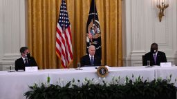 US President Joe Biden, with Secretary of State Antony Blinken (L) and Defense Secretary Lloyd Austin, holds his first cabinet meeting in the East Room of the White House in Washington, DC, on April 1, 2021. 