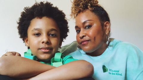 Jennifer White-Johnson sits with her 8-year-old Black and autistic son, Kevin 'Knox' Johnson III.