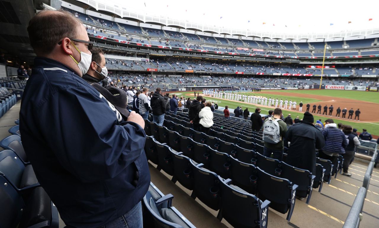 Fans stand for the National Anthem at the New York Yankees' home opener on Thursday, April 1.