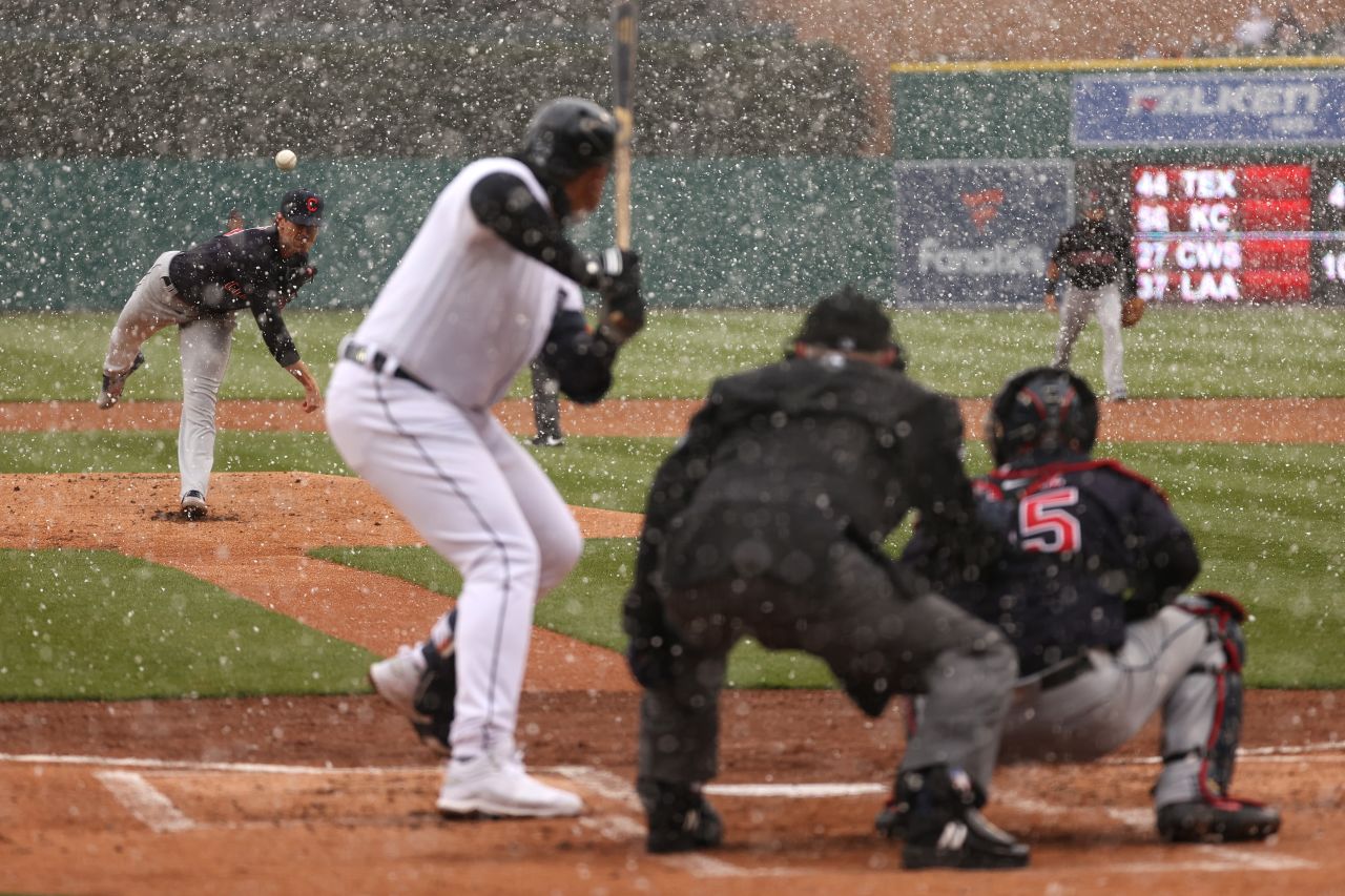 Cleveland's Shane Bieber throws a first-inning pitch to Detroit's Miguel Cabrera, who homered to right field. The game in Detroit started with snow flurries.