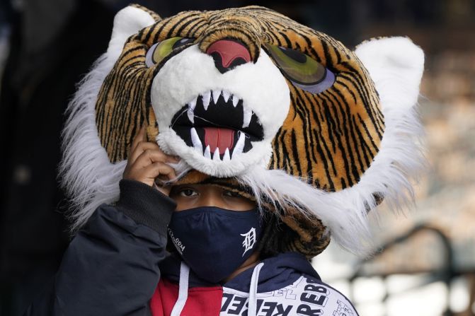 Mark Batie Jr. wears a tiger head at Detroit's home opener.