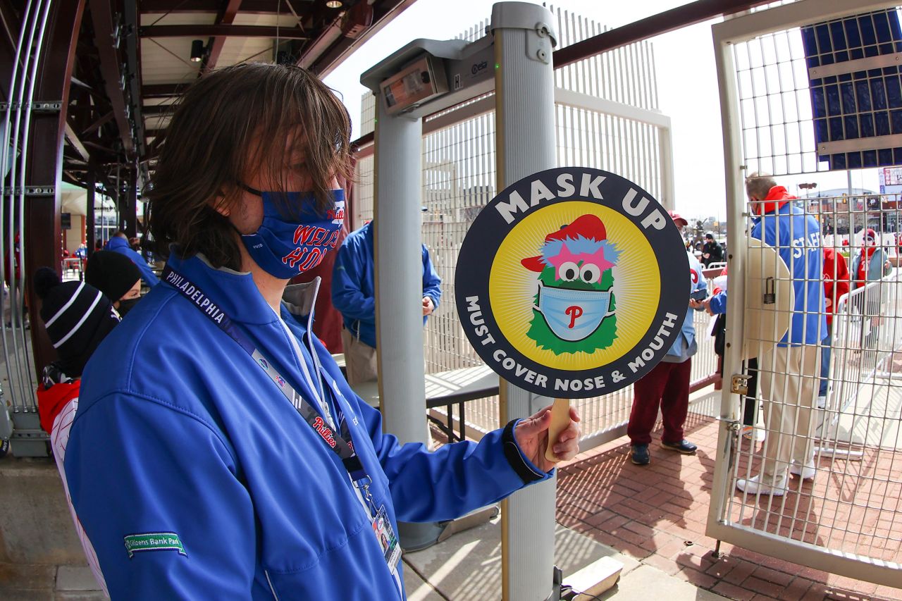 The Phillie Phanatic, the iconic mascot of the Philadelphia Phillies, is seen on a sign urging fans to "mask up" at Citizens Bank Park.