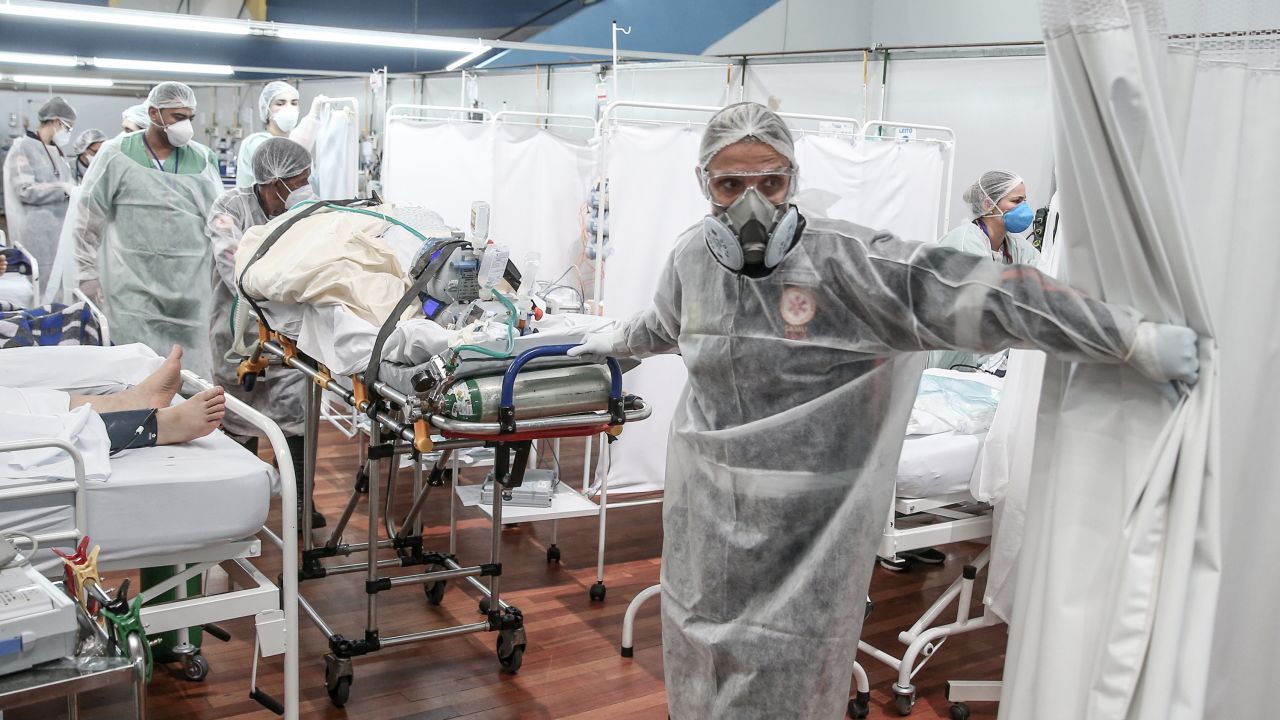 Medical staff transport a patient on a stretcher at a field hospital in Santo Andre, Brazil on March 11.