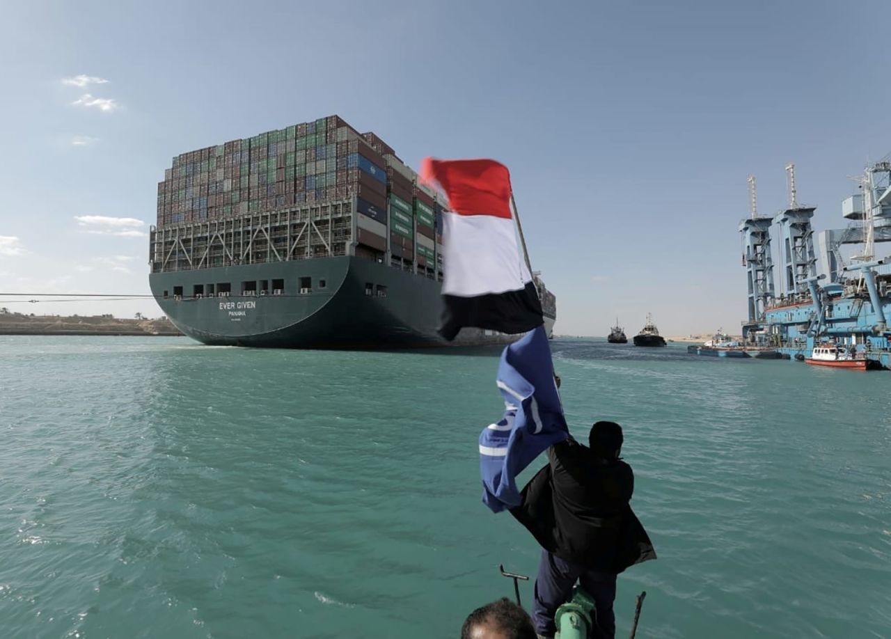 A man waves an Egyptian flag as the Ever Given container ship was refloated in Egypt's Suez Canal on Monday, March 29. <a href="http://www.cnn.com/2021/03/26/world/gallery/suez-canal-stuck-ship/index.html" target="_blank">The ship was stuck in the canal for almost a week,</a> halting marine traffic in what is one of the busiest waterways in the world.
