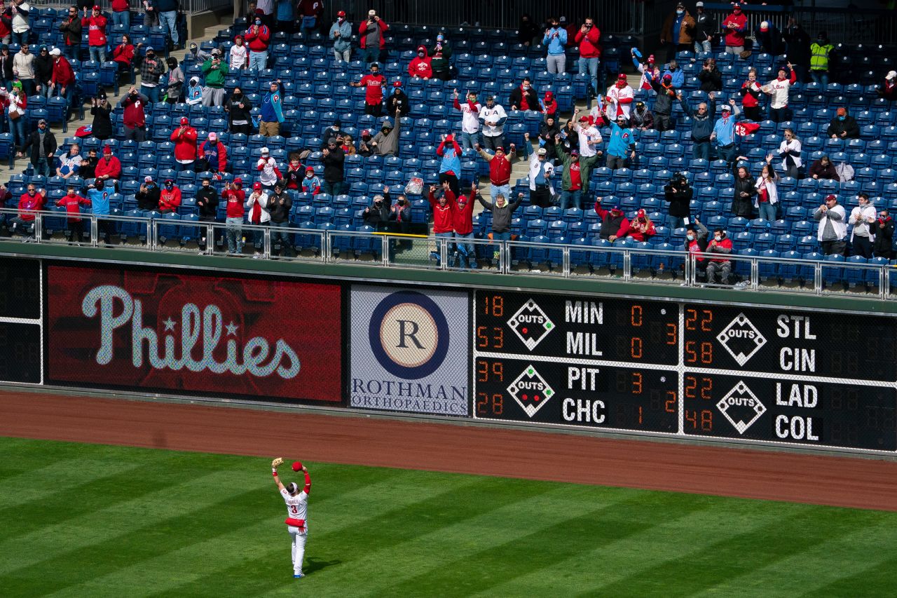 Phillies star Bryce Harper waves to fans before the start of the first inning.
