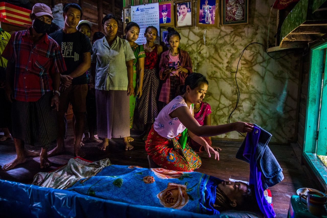 Family members mourn near the body of Kyaw Htet Aung, a 19-year-old who was fatally shot by security forces in Dala, Myanmar, on Saturday, March 27. <a href="https://www.cnn.com/2021/02/16/asia/gallery/myanmar-unrest/index.html" target="_blank">Protesters are being met with deadly force in Myanmar,</a> where the military seized power in a coup on February 1.