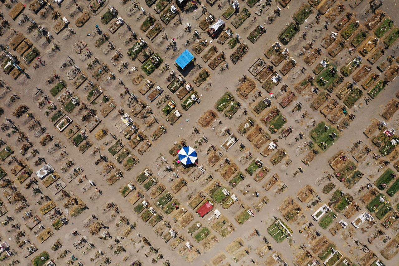 This aerial photo shows graves for Covid-19 victims at a cemetery in Valle de Chalco, Mexico, on Friday, March 26. Mexico is the third country in the world to surpass 200,000 coronavirus deaths, after the United States and Brazil.