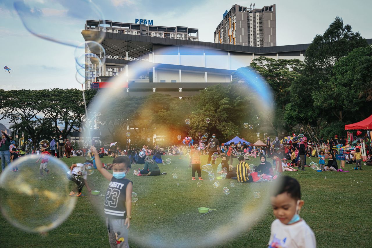 Children play with bubbles at a park in Kuala Lumpur, Malaysia, on Monday, March 29.
