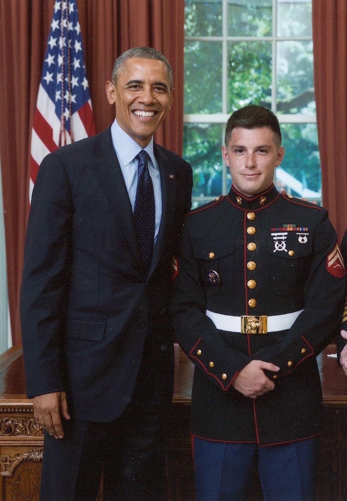 President Obama poses with Trevor Reed in an undated White House photo.