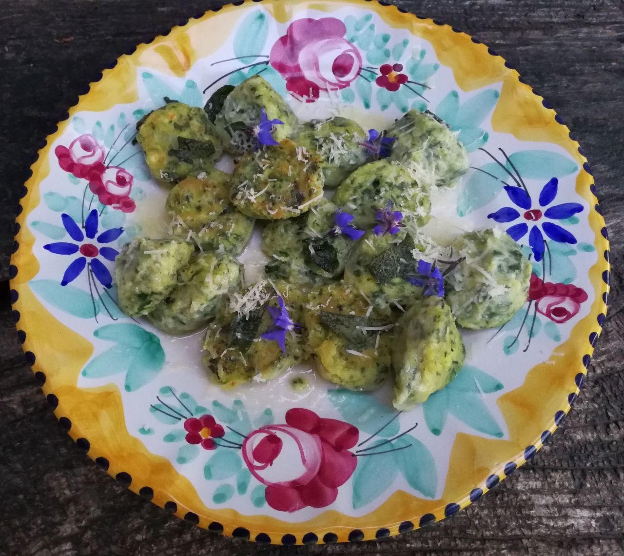 Gnudi, or naked ravioli, are made with foraged herbs and served with sage butter sauce and Parmesan. These tasty bites are "naked" because they have no pasta dough around them. The spinach and ricotta filling is made into a gnocchi-like dumpling.