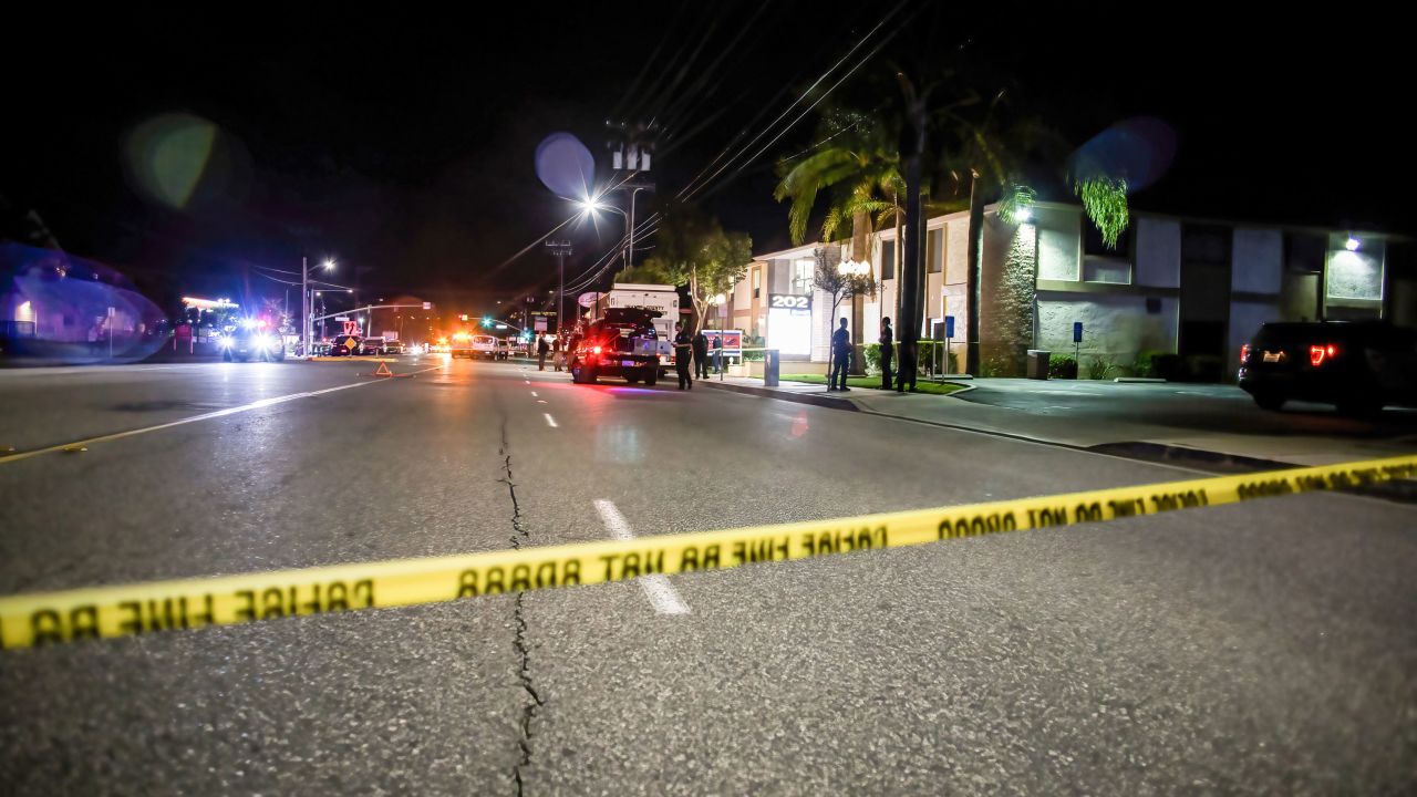 Police tape cordons off the building where the shooting occurred.