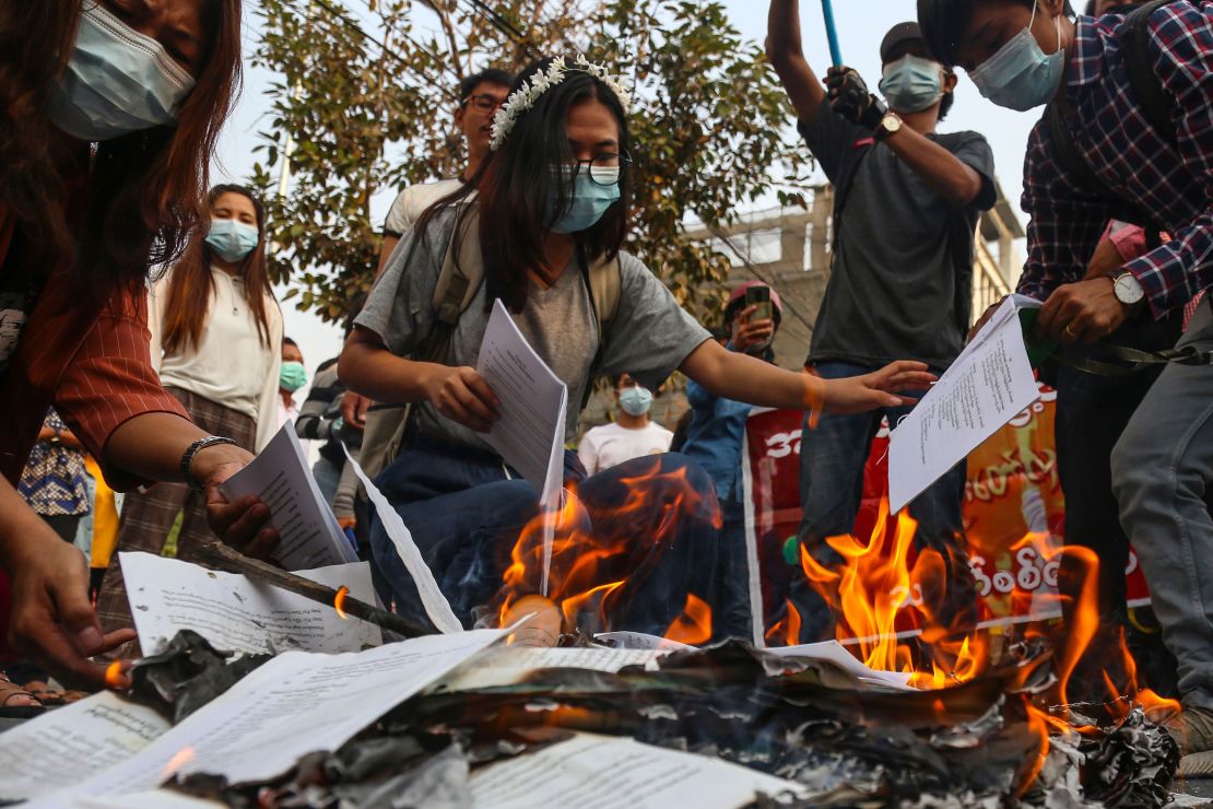 Demonstrators burn a copy of Myanmar's constitution during a protest against the military coup in Mandalay, Myanmar, on April 1. 