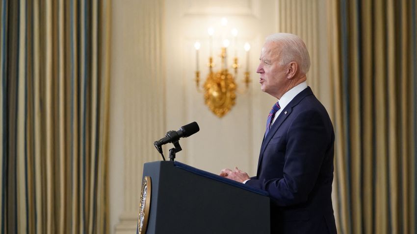 US President Joe Biden speaks about the March jobs report in the State Dining Room of the White House in Washington, DC, on April 2, 2021. - The US economy regained a massive 916,000 jobs in March, the biggest increase since August, with nearly a third of the increase in the hard-hit leisure and hospitality sector, the Labor Department reported on April 2, 2021.