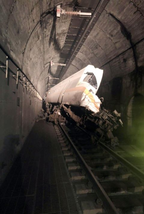 Part of the train's wreckage is seen in the tunnel.