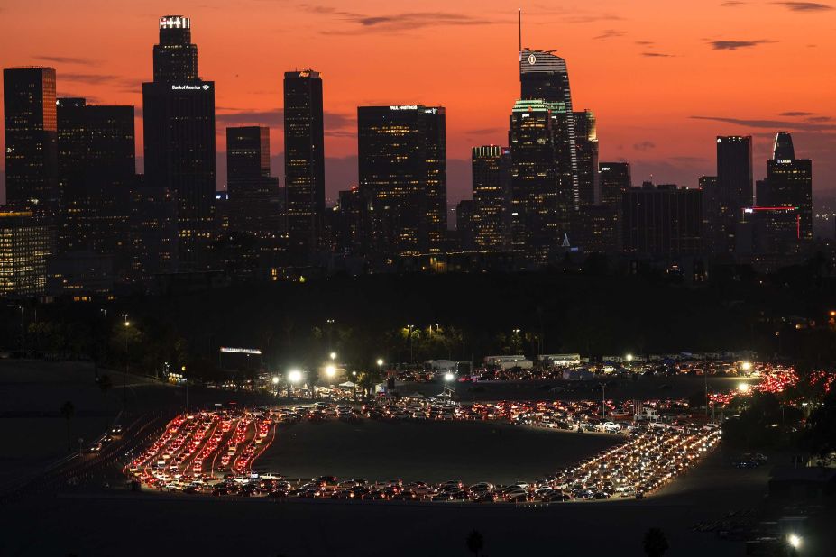 Motorists wait in lines for Covid-19 tests outside of Los Angeles' Dodger Stadium on January 4. 