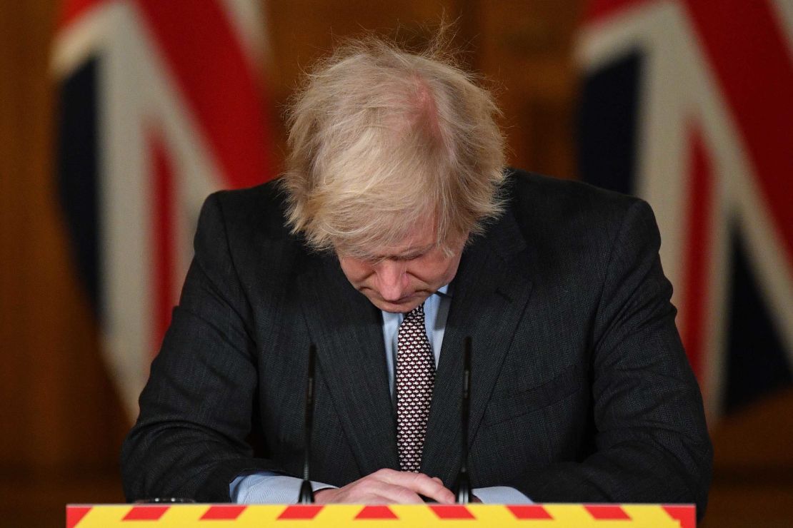 The UK Prime Minister looks down at the podium as he attends a virtual press conference on the pandemic, inside 10 Downing Street in January.