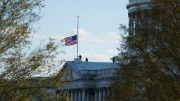 The American flag at the U.S. Capitol flies at half-staff in honor of Capitol Police officer William Evans who was killed after a man rammed a car into two officers at a barricade outside the U.S. Capitol in Washington, Friday, April 2, 2021. (AP Photo/Alex Brandon)