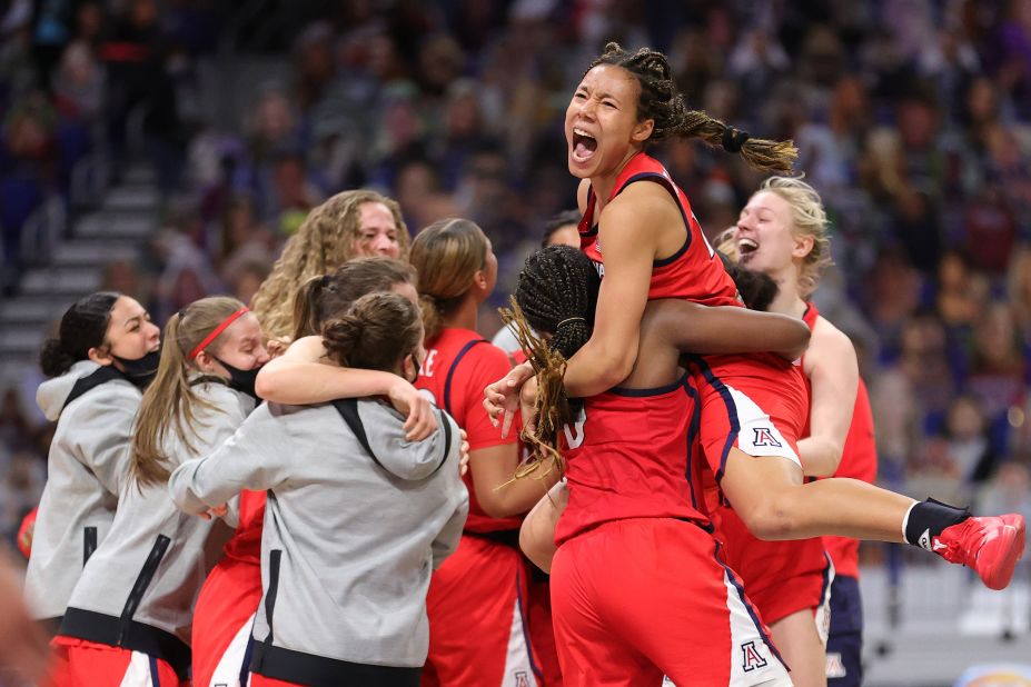 Arizona players celebrate after their Final Four victory over Connecticut on Friday. The Wildcats, playing in their first Final Four, won 69-59.