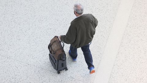 A traveler walks through Terminal 5 at John F. Kennedy International Airport in New York.