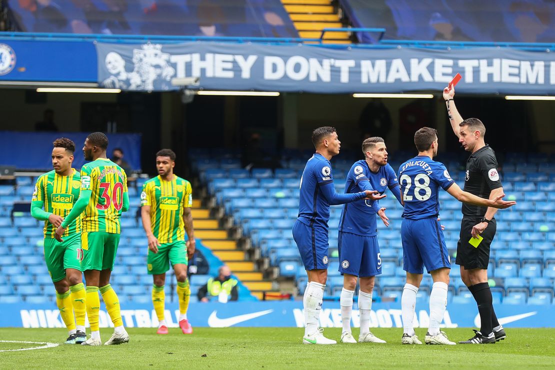 Thiago Silva of Chelsea and teammates Jorginho and Cesar Azpilicueta argue with match referee David Coote after the Brazilian is shown a red card during the Premier League match against West Bromwich Albion at Stamford Bridge.