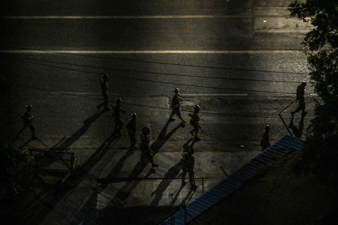 Soldiers are seen patrolling a street in Yangon on April 2.