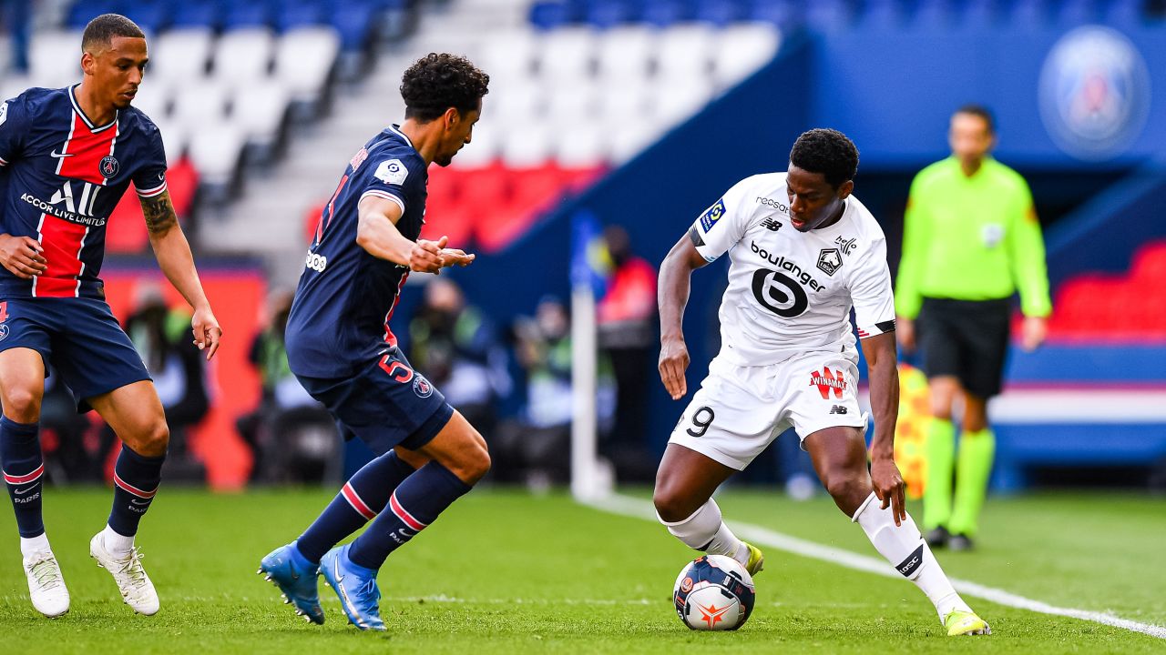 PSG's Marquinhos watches Jonathan David of Lille with the ball during the French Ligue 1 match between the two teams at the Parc des Princes on April 3.