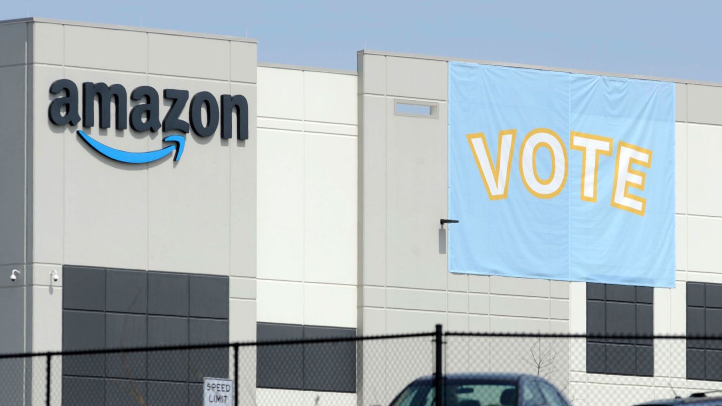 In this March 30 photo, a banner encouraged workers to vote in labor balloting at an Amazon warehouse in Bessemer, Ala. 