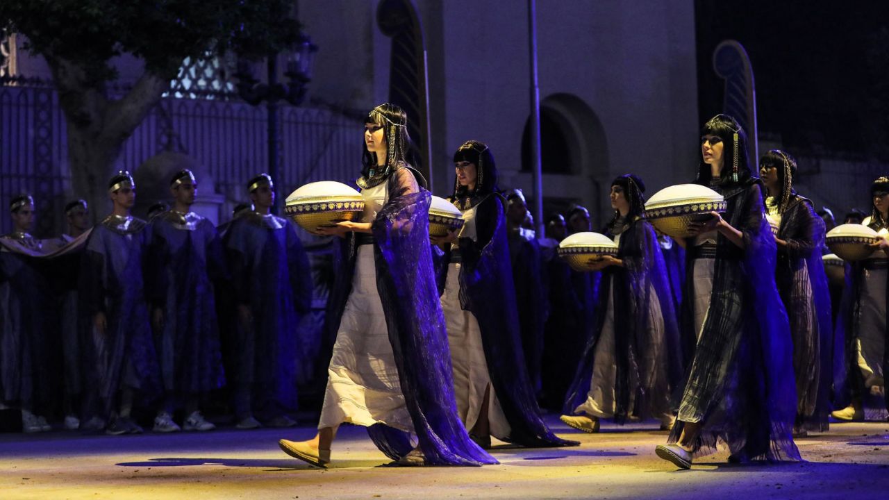 Performers dressed in ancient Egyptian costume march at the start of the parade of 22 ancient Egyptian royal mummies departing from the Egyptian Museum in Cairo's Tahrir Square.