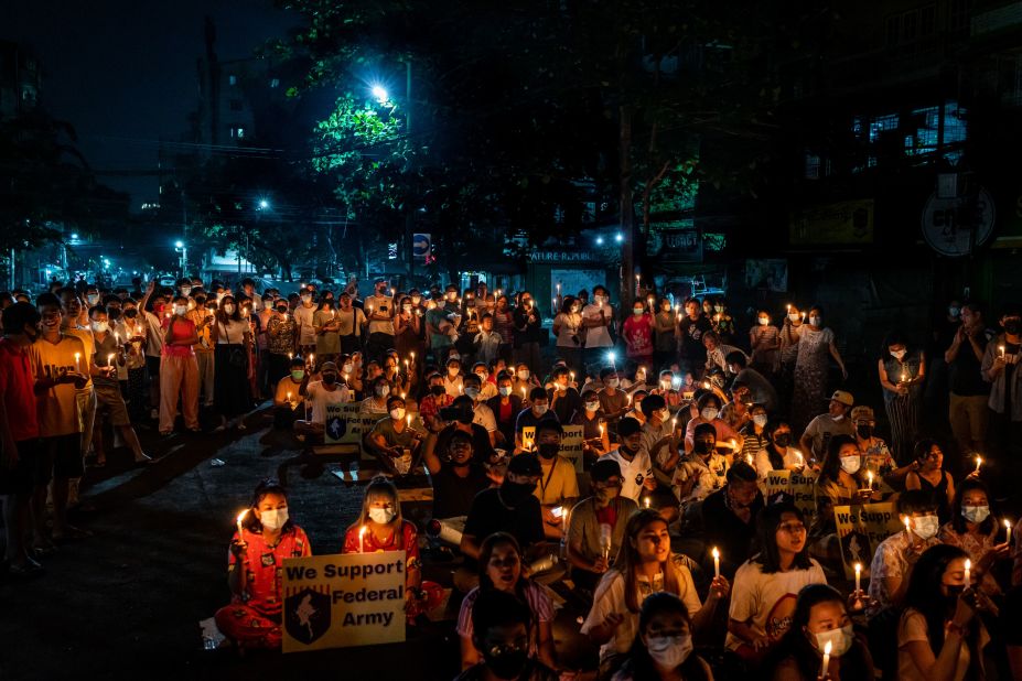 Residents of the Tamwe area of Yangon participate in a candlelight vigil on April 3.