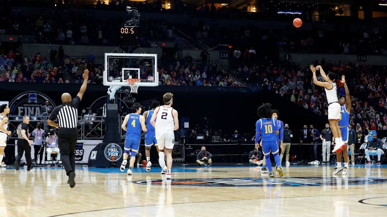 Gonzaga's Jalen Suggs shoots a long 3-pointer to beat UCLA in the semifinals on Saturday. <a href="index.php?page=&url=http%3A%2F%2Fwww.cnn.com%2F2021%2F04%2F03%2Fsport%2Fbaylor-v-houston-final-four-game-results%2Findex.html" target="_blank">The dramatic buzzer-beater</a> gave the Bulldogs a 93-90 overtime win.