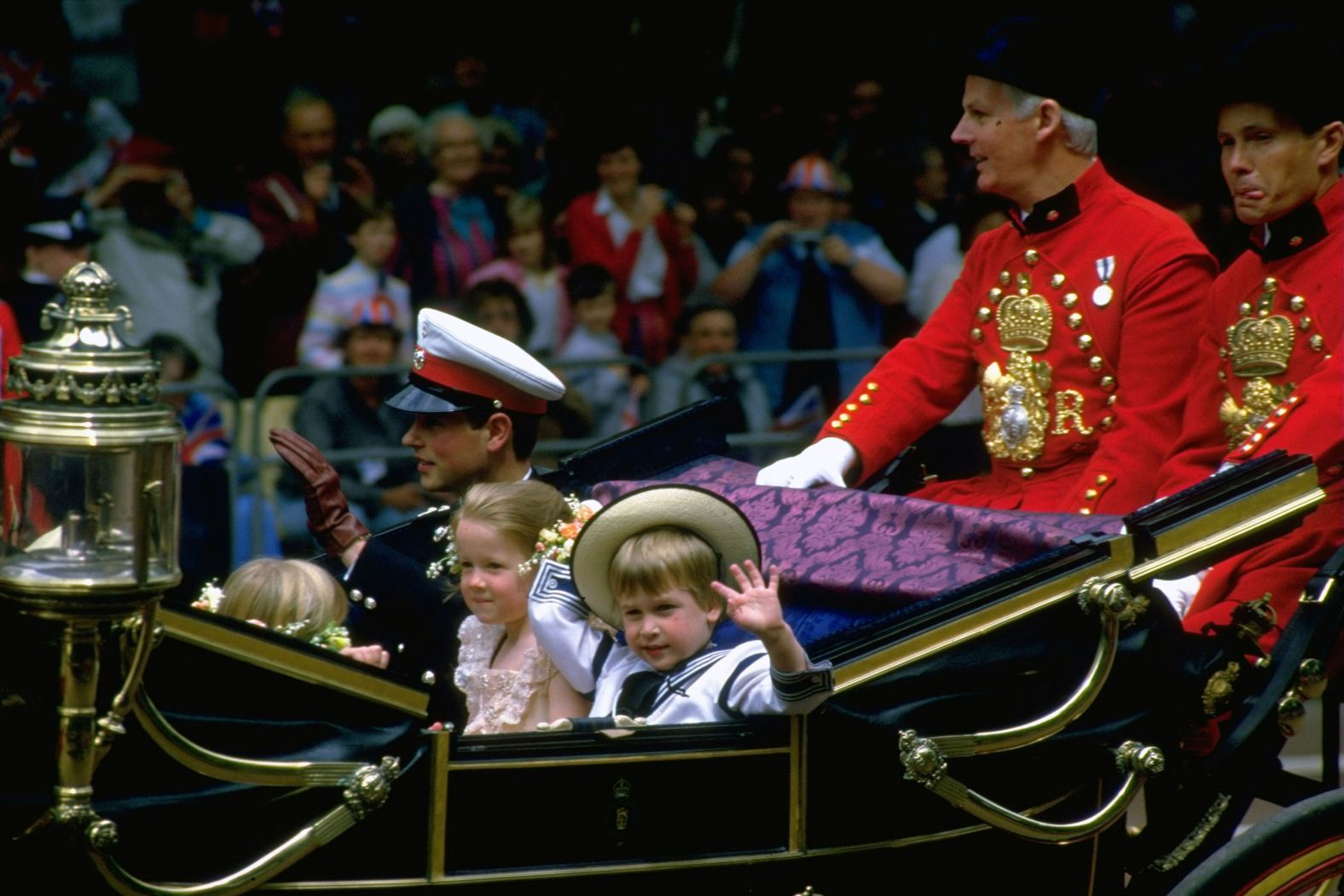 Prince William waves from a carriage en route to the wedding of his uncle Prince Andrew and Sarah Ferguson in 1986.