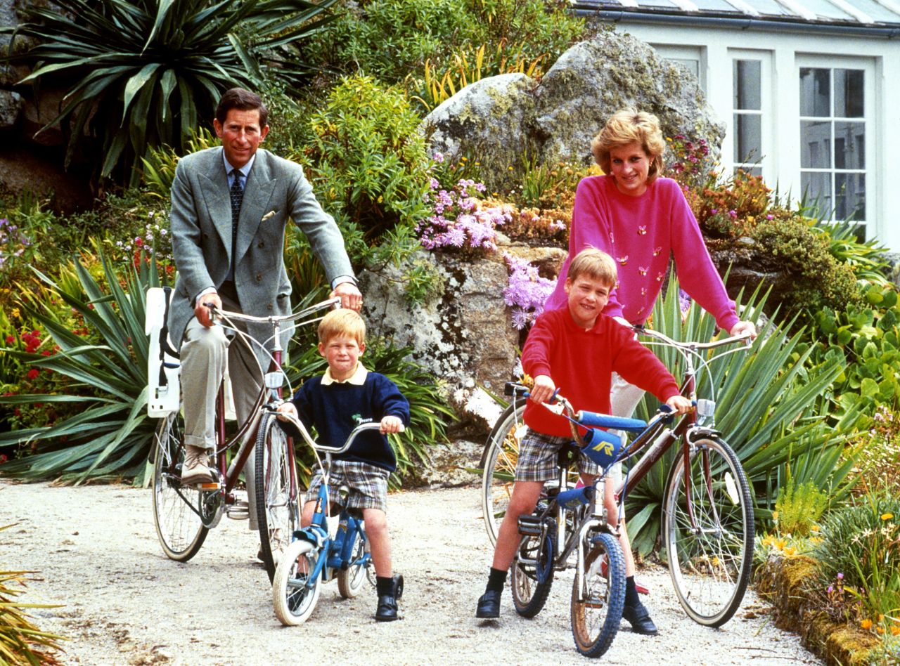 William and Harry ride bicycles with their parents while on vacation in the Isles of Scilly in 1989.