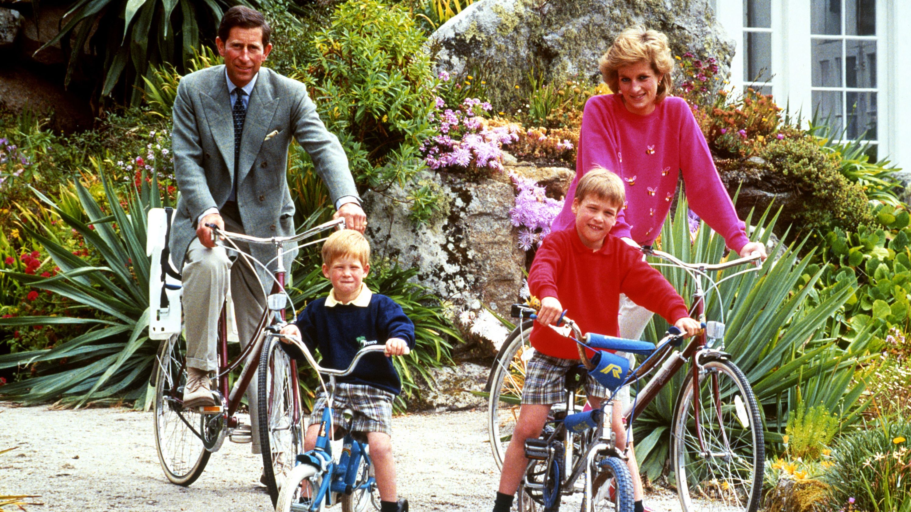 William and Harry ride bicycles with their parents while on vacation in the Isles of Scilly in 1989.