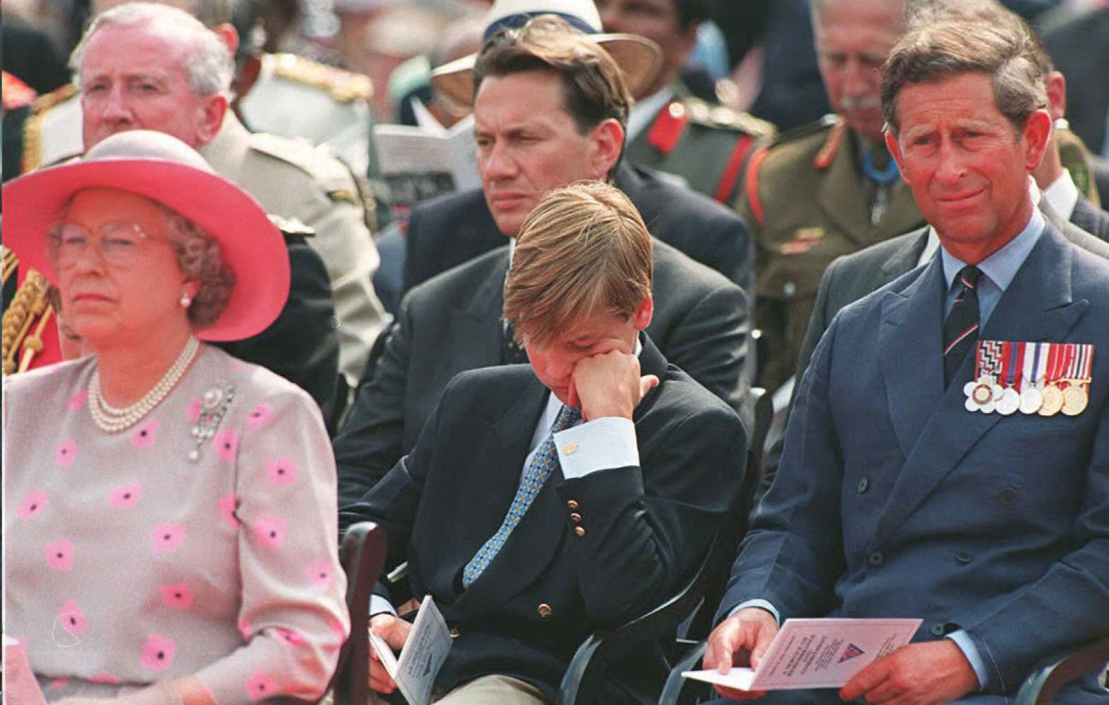 Queen Elizabeth II, Prince William and Prince Charles attend a service commemorating V-J Day outside Buckingham Palace in 1995.