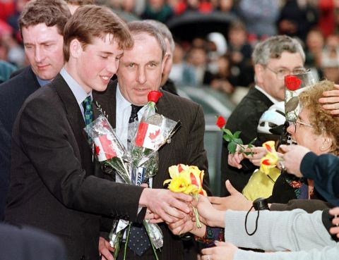 Prince William receives flowers from an adoring crowd in Vancouver on March 24, 1998. He was on a weeklong vacation with his father and brother, though they also made time for official engagements.