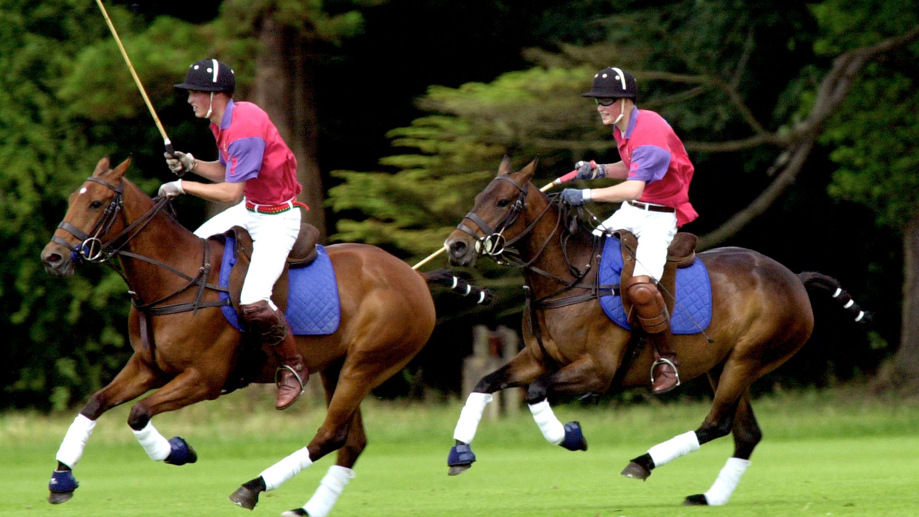 William, left, and Harry take part in an exhibition polo match in Gloucestershire, England, in 2001.