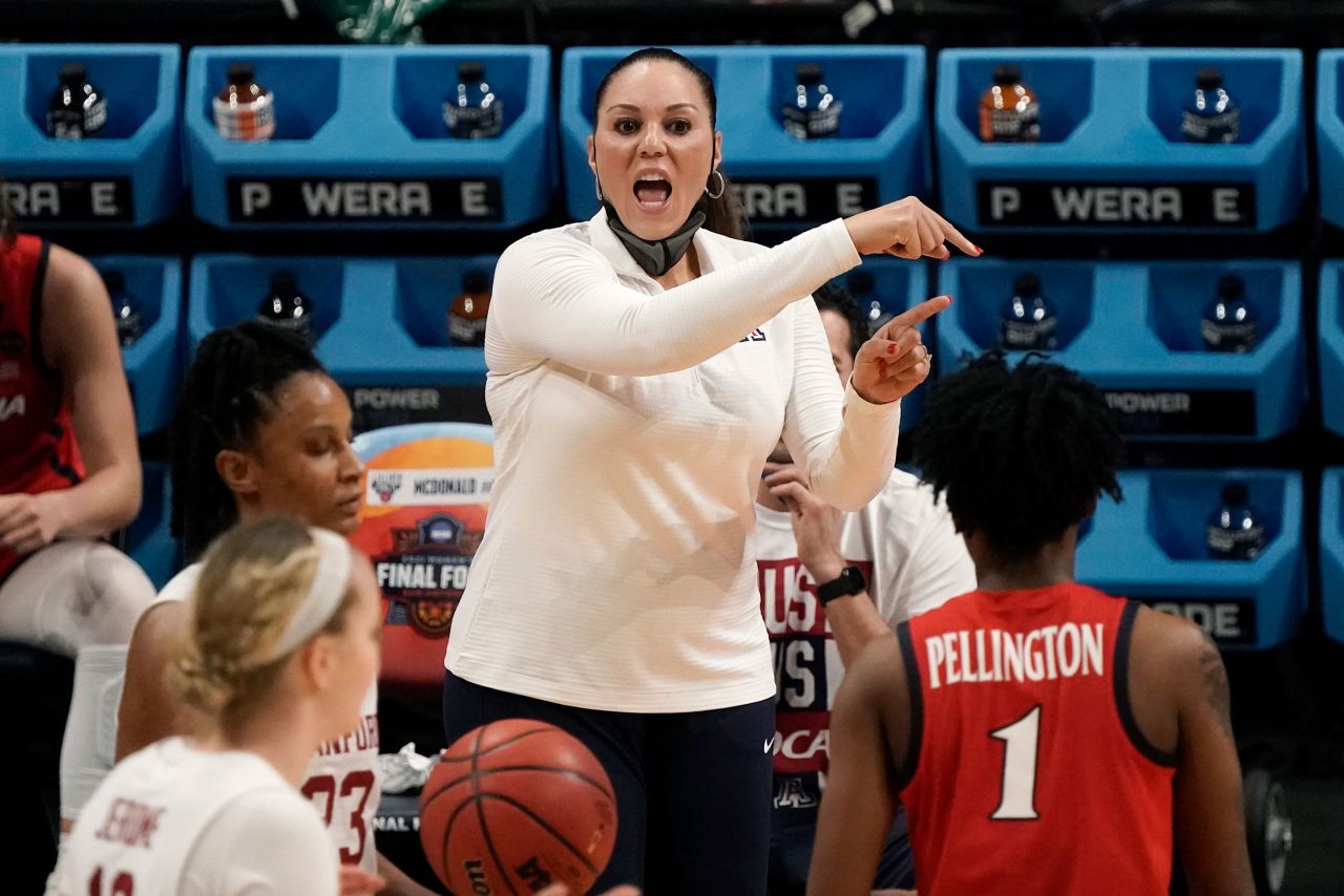 Arizona head coach Adia Barnes directs her team during the first half of Sunday's game.