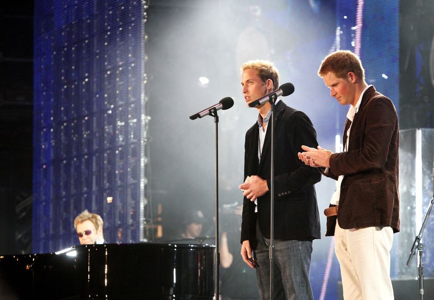 Prince William and Prince Harry speak on stage with Elton John, far left, during a concert they put on to celebrate Princess Diana in 2007. The event fell on what would have been their mother's 46th birthday.