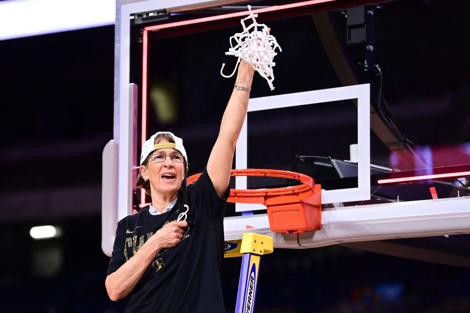 Stanford head coach Tara VanDerveer -- the winningest coach in the history of women's college basketball -- cuts down the net after Sunday's win.