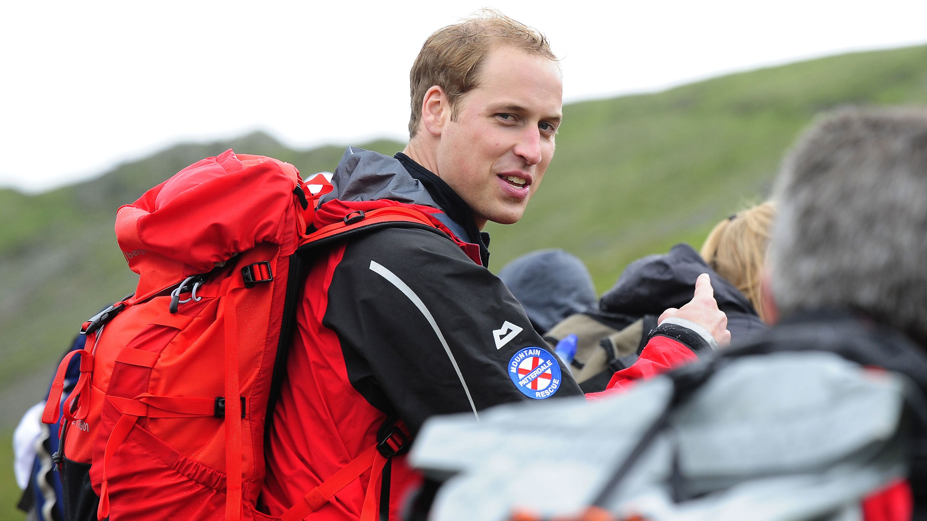 Prince William walks with a group of homeless people during a 2009 hike with Centrepoint, the United Kingdom's largest youth charity for the homeless. William became the patron of the organization in 2005.