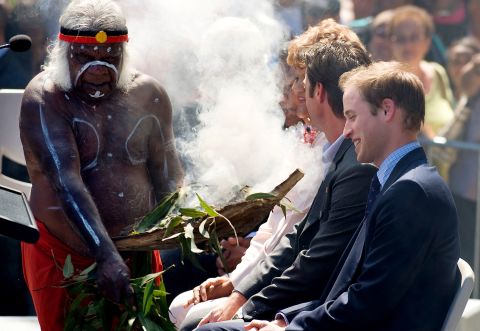 During his first official overseas visit, Prince William is welcomed to Sydney with a traditional smoke ceremony by local Aboriginal elder Uncle Max in 2010.