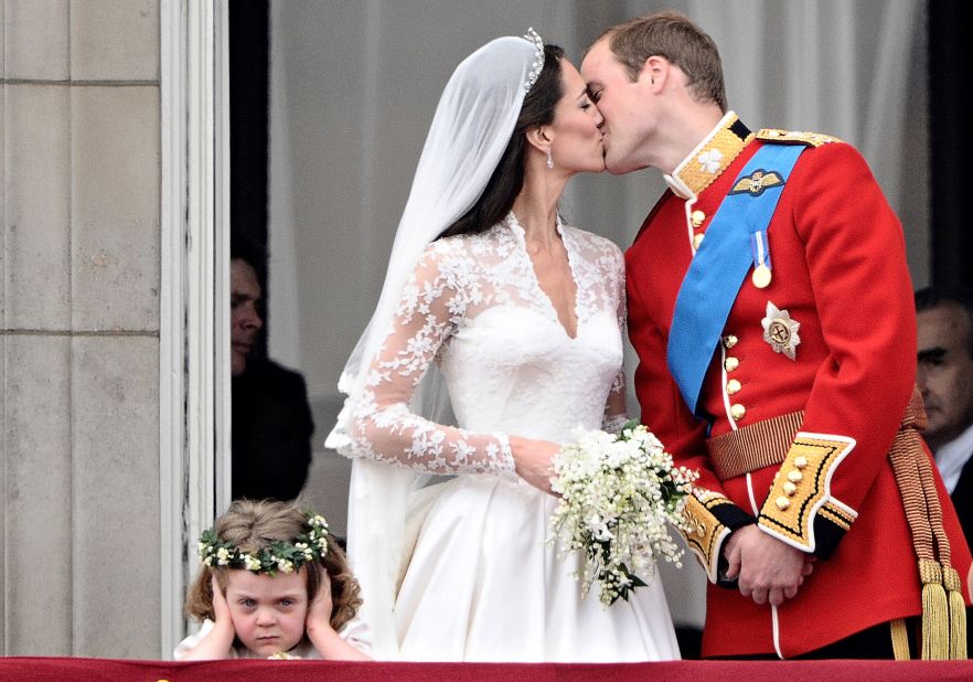 Prince William kisses his wife, Catherine, on the balcony of Buckingham Palace after their wedding on April 29, 2011. The two met while attending the University of St. Andrews.