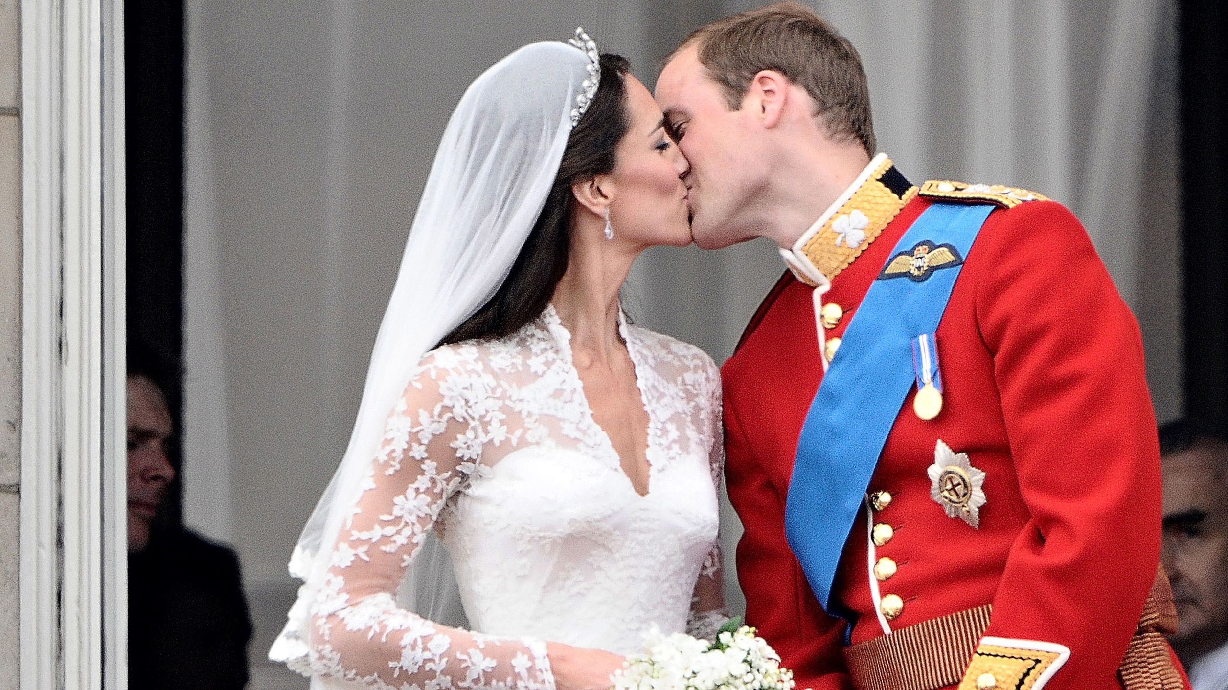 Prince William kisses his wife, Catherine, on the balcony of Buckingham Palace after their wedding on April 29, 2011. The two met while attending the University of St. Andrews.