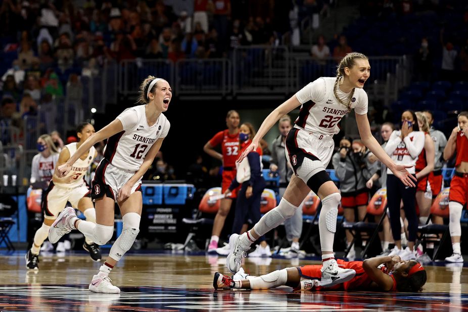 Stanford players react after McDonald, bottom right, missed her shot at the buzzer.