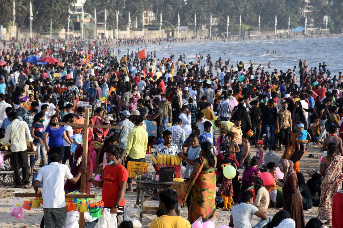 People enjoy warm weather at Juhu Beach in Mumbai, India, on April 4. 