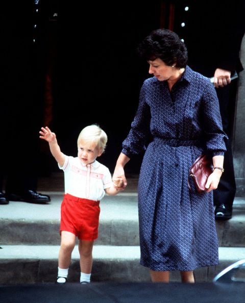 Accompanied by his nanny Barbara Barnes, Price William waves as he leaves St. Mary's Hospital after visiting his mother and his newborn brother, Prince Harry, on September 16, 1984.