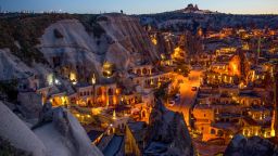 NEVSEHIR, TURKEY - APRIL 17: Light illuminates cave hotels at sunset in the town of Goreme on April 17, 2016 in Nevsehir, Turkey. Cappadocia, a historical region in Central Anatolia dating back to 3000 B.C is one of the most famous tourist sites in Turkey. Listed as a World Heritage Site in 1985, and known for its unique volcanic landscape, fairy chimneys, large network of underground dwellings and some of the best hot air ballooning in the world, Cappadocia is preparing for peak tourist season to begin in the first week of May. Despite Turkey's tourism downturn, due to the recent terrorist attacks, internal instability and tension with Russia, local vendors expect tourist numbers to be stable mainly due to the unique activities on offer and unlike other tourist areas in Turkey such as Antalya, which is popular with Russian tourists, Cappadocia caters to the huge Asian tourist market. (Photo by Chris McGrath/Getty Images)