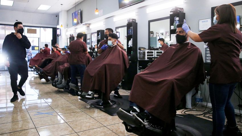 Barbers from King's Cutz give haircuts indoors while observing COVID-19 safety restrictions on March 13, 2021 in Los Angeles, California.