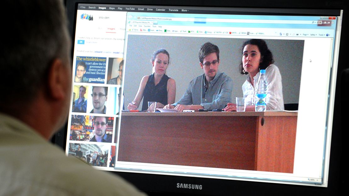 US National Security Agency fugitive leaker Edward Snowden (center) was stuck in transit at Moscow's Sheremetyevo airport from June to August 2013. 