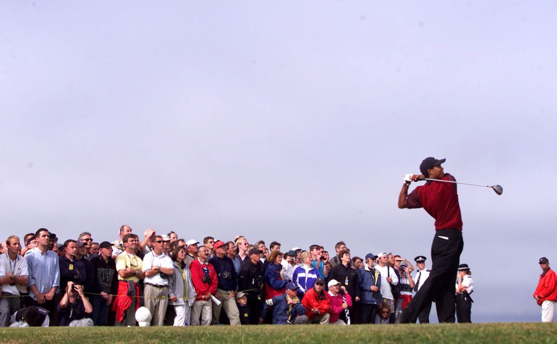 Woods tees-off on the 13th hole on the Old Course at St. Andrews at the Open Championship.